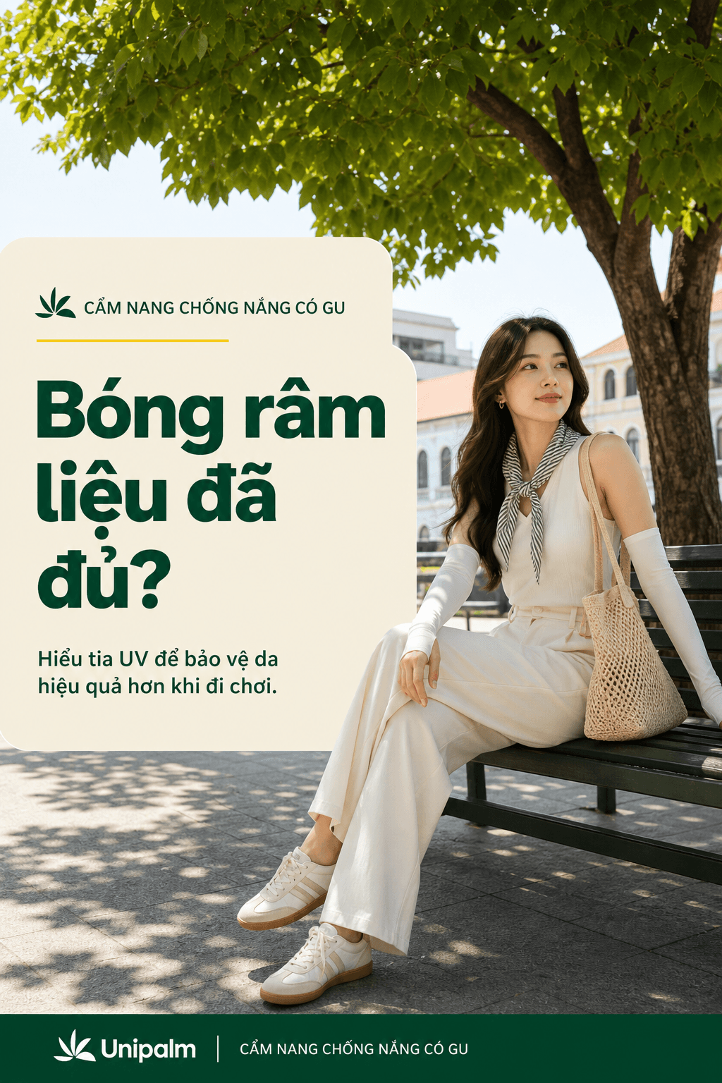 Một cô gái trẻ đang ngồi thư giãn dưới bóng cây nhưng vẫn đeo găng tay chống nắng, thể hiện sự bảo vệ toàn diện.